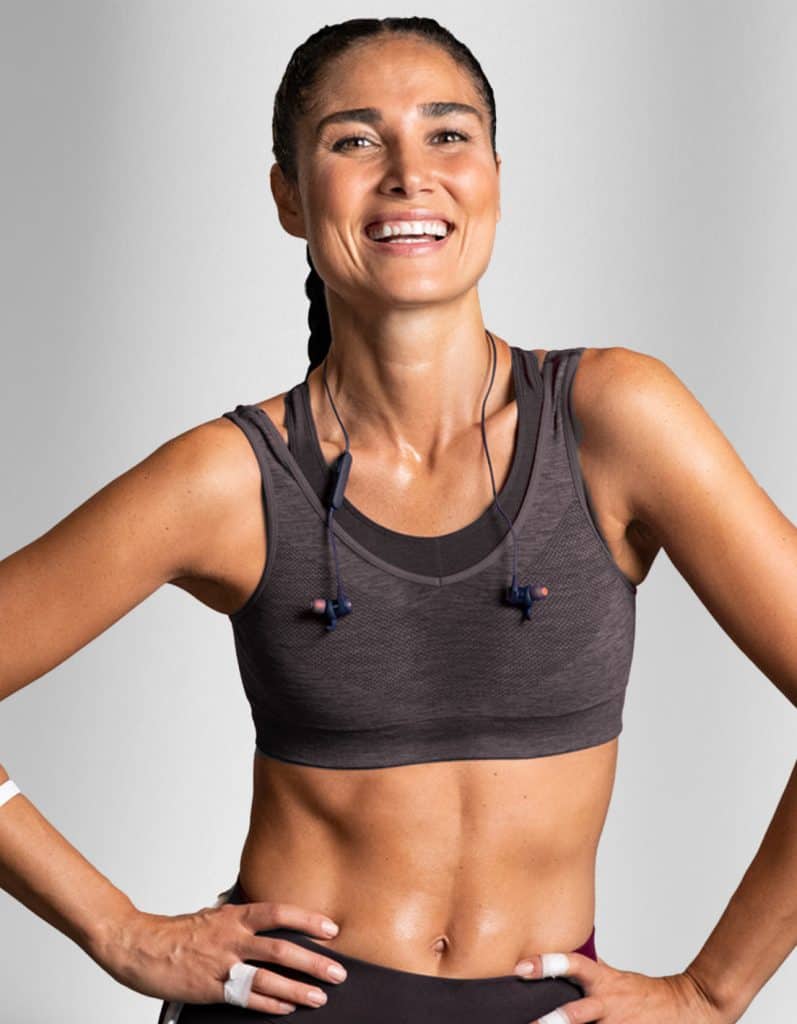 Young and physically fit woman smiling | Medical Aesthetics & Wellness of Modesto